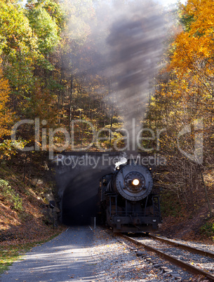 Steam locomotive leaving tunnel