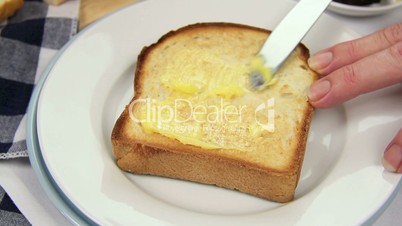 Buttering Toast
