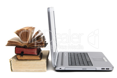 laptop and old book