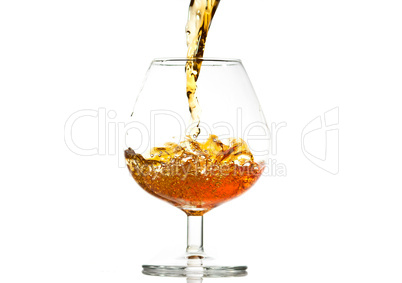 filling a glass of brandy