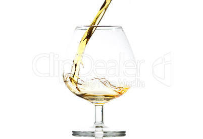 filling a glass of brandy