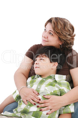 little boy looking something interesting to his mother against w