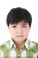 Portrait of beautiful little boy with serious look isolated on w