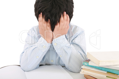 Schoolboy being stressed by his homework, isolated on white back
