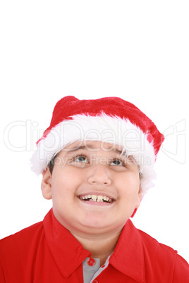 Head shot of young beauty Santa boy looking up to copy space and
