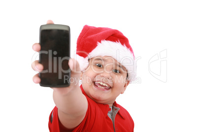 Little boy showing cell phone screen over white background. Boy