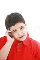 Young boy talking to cell phone, isolated on white background.