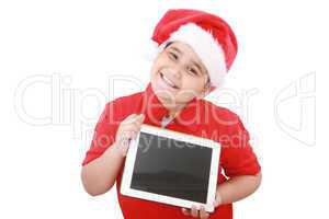 Adorable child with Santa hat offering a tablet isolated on whit