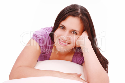 Portrait of cute young girl laying down in her bed