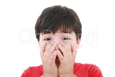 Preschool aged boy with his hand/fists over his mouth; looking e