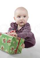 young baby with gift