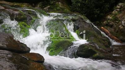 Waterfall Over Mossy Rocks