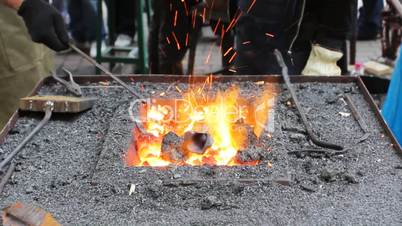 Blacksmith Heats Rod