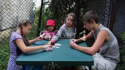 children play playing cards