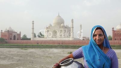 Indian Woman wearing Sari in front of Taj Mahal