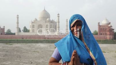 Indian Woman wearing Sari in front of Taj Mahal