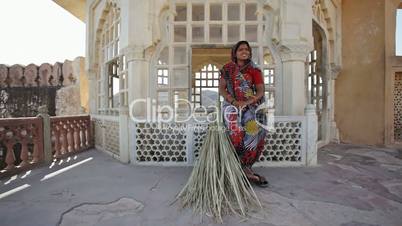 Indian Woman With Reed Broom