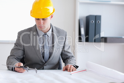 Architect checking plan