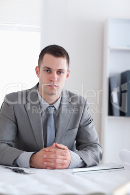 Close up of architect sitting behind a table