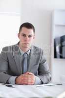 Close up of architect sitting behind a table