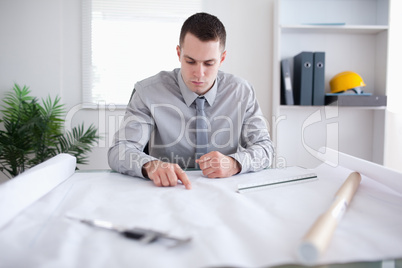 Architect working on construction plan