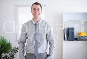 Businessman smiling and standing