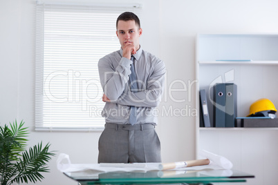 Businessman standing and thinking