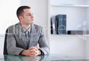 Businessman sitting behind a table