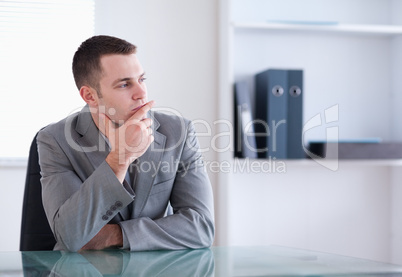 Businessman thinking and sitting