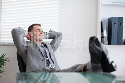 Smiling businessman taking a rest