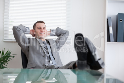 Smiling businessman taking a break