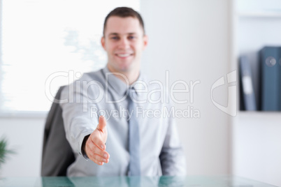 Smiling businessman greeting negotiation partner