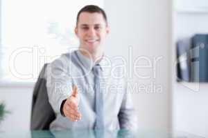 Smiling businessman greeting negotiation partner
