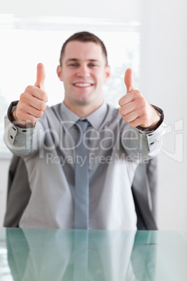Close up of businessman giving thumbs up