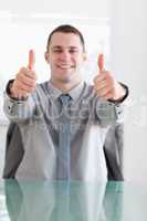 Close up of businessman giving thumbs up