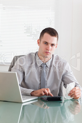 Businessman checking an invoice
