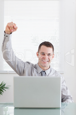 Close up of businessman getting awesome news via email