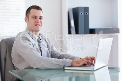 Young businessman using his notebook