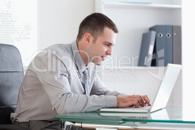 Businessman working concentrated on his laptop