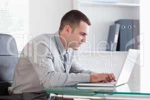 Businessman working concentrated on his laptop