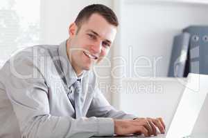 Close up of businessman typing on his laptop