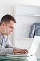 Businessman typing on his notebook