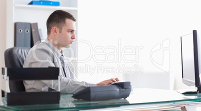 Businessman writing an email