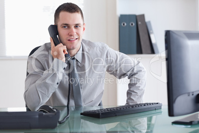 Businessman listening carefully to caller