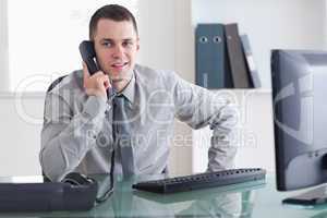 Businessman listening carefully to caller