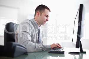 Businessman working concentrated on his computer