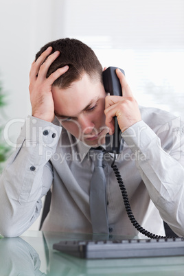 Businessman getting disappointed on the phone