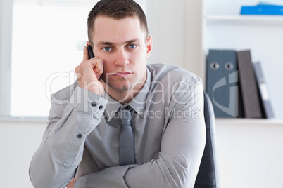 Businessman listening to caller on his cellphone