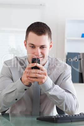 Businessman getting a pleasant text message
