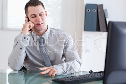 Businessman talking to costumer on the cellphone